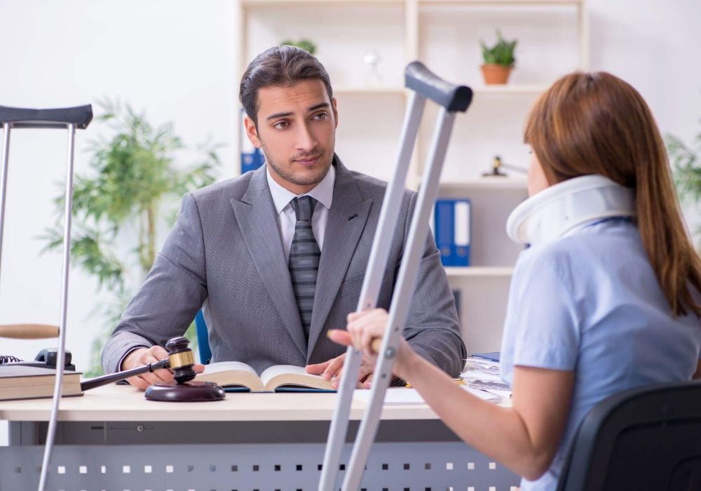 a woman sitting at a desk with a judge