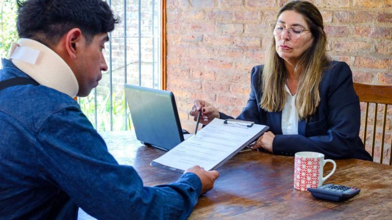 a woman sitting at a table with a man