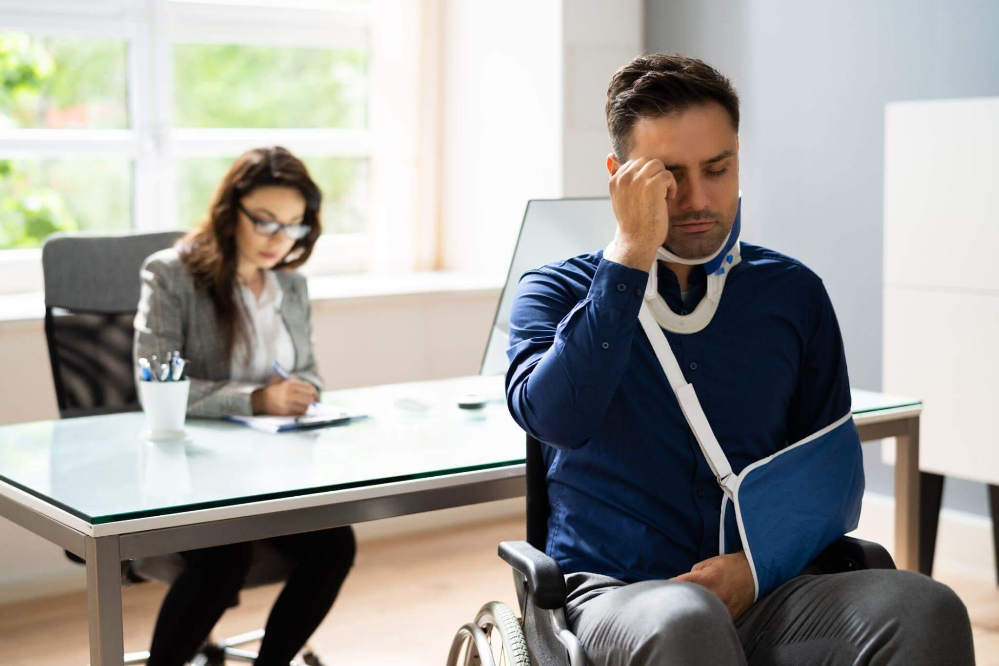 a person wearing an arm cast looks upset, he is having a consultation in an office