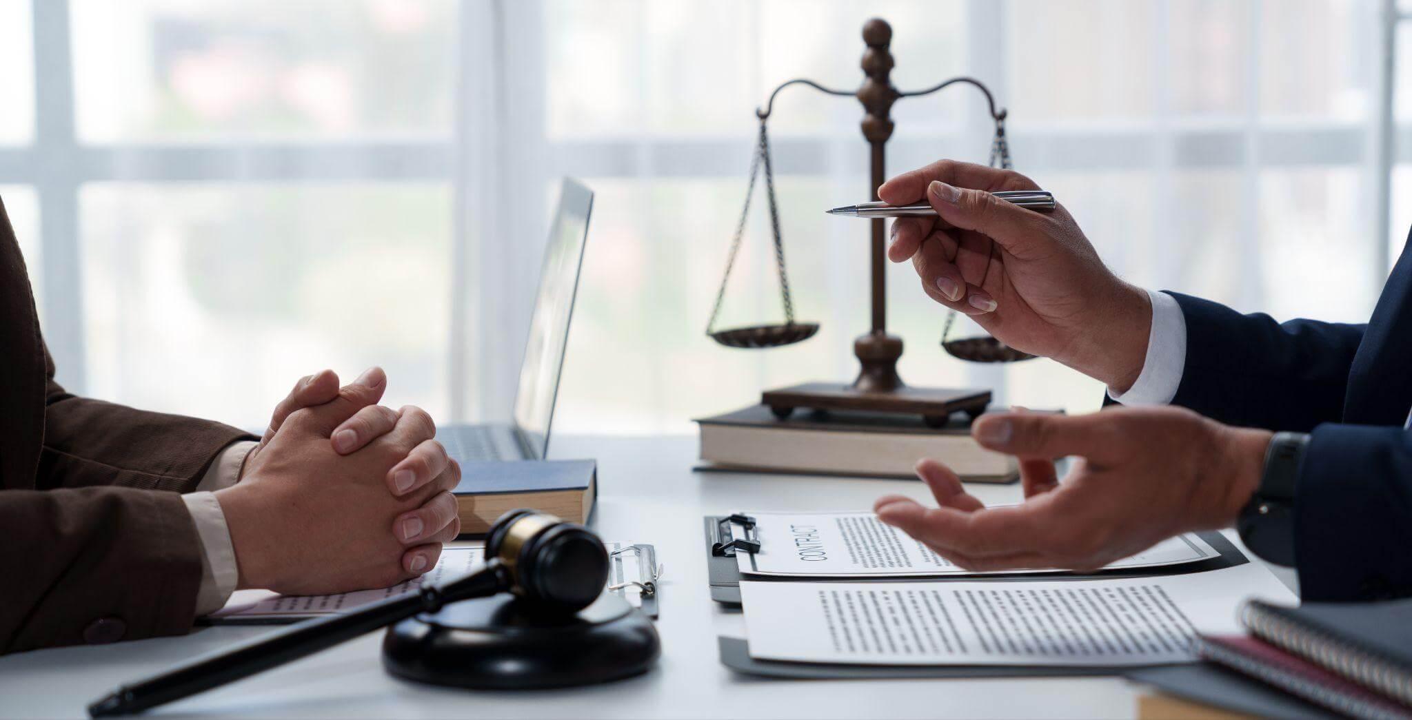 two people discussing a topic in a legal office