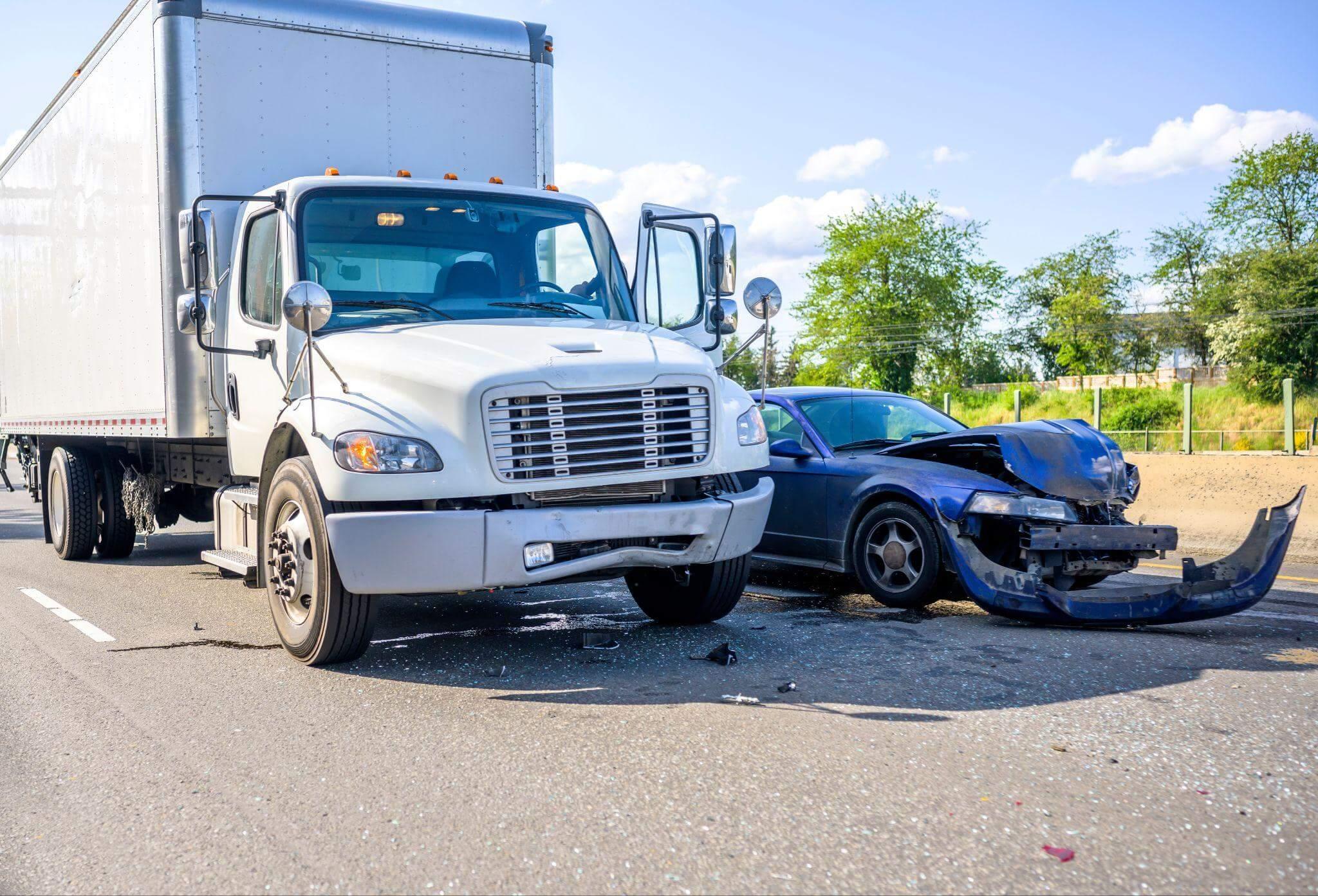 Car crashed into a truck on the side of