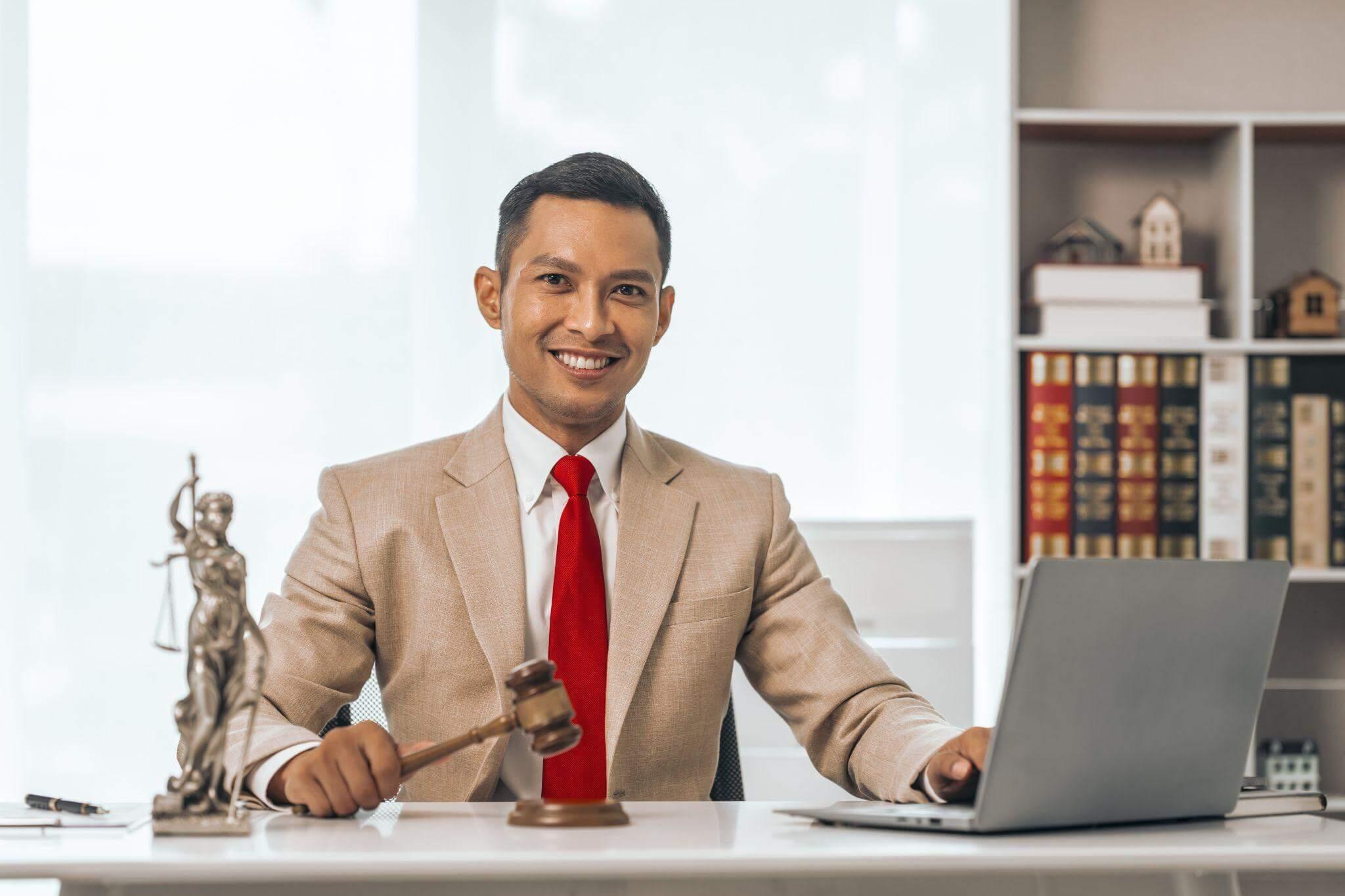 Man in a suit sitting at a desk with